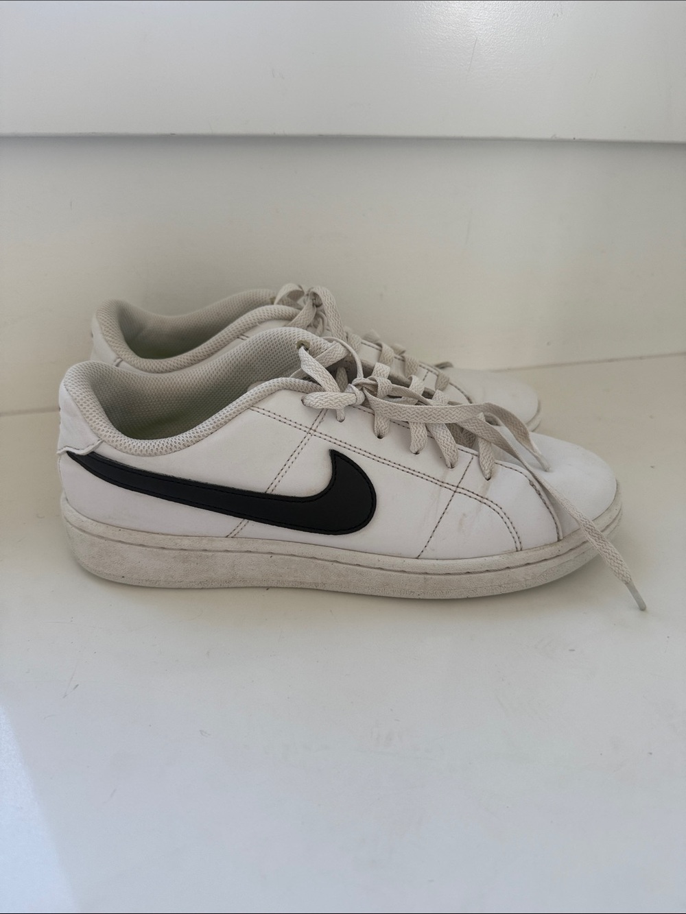 Nike White Low-Top Sneakers with Black Swoosh
